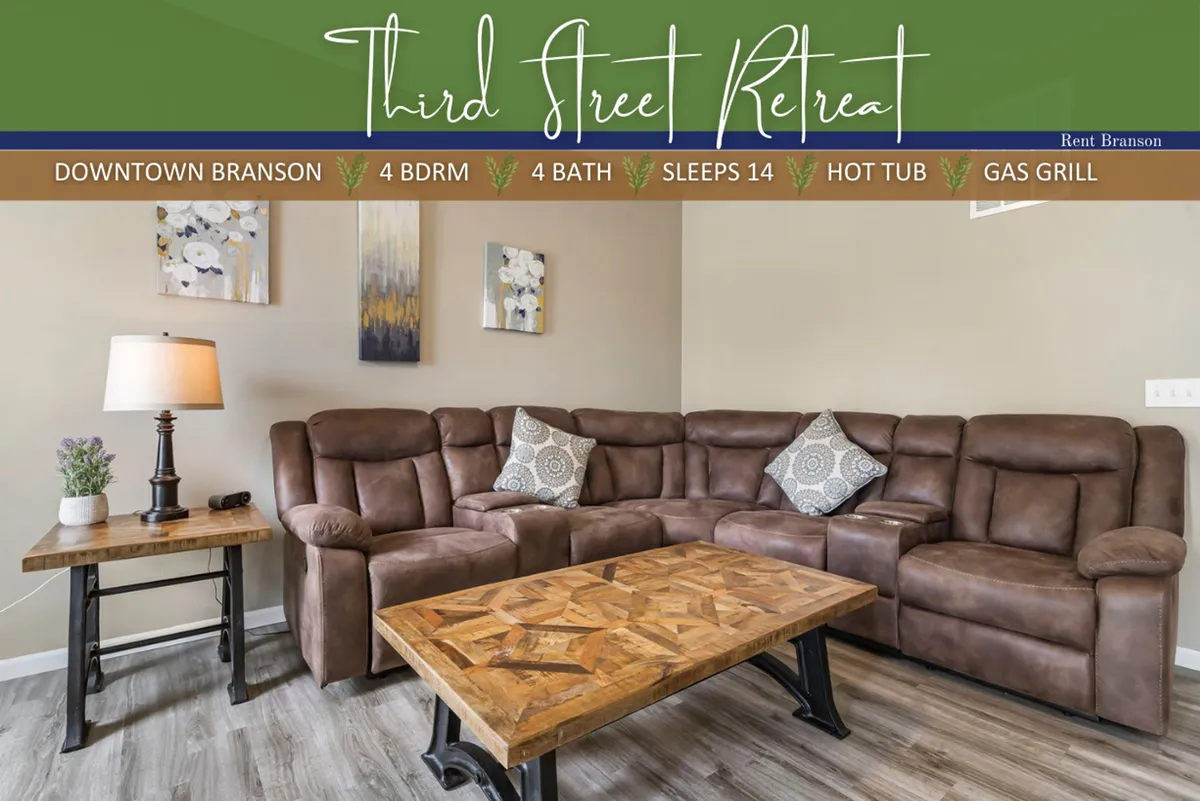 A bright, inviting living room with a large sectional sofa, coffee table, lamp, and wall art. The arrangement encourages socializing, relaxing, and gatherings, reflecting a welcoming atmosphere for guests to unwind together.